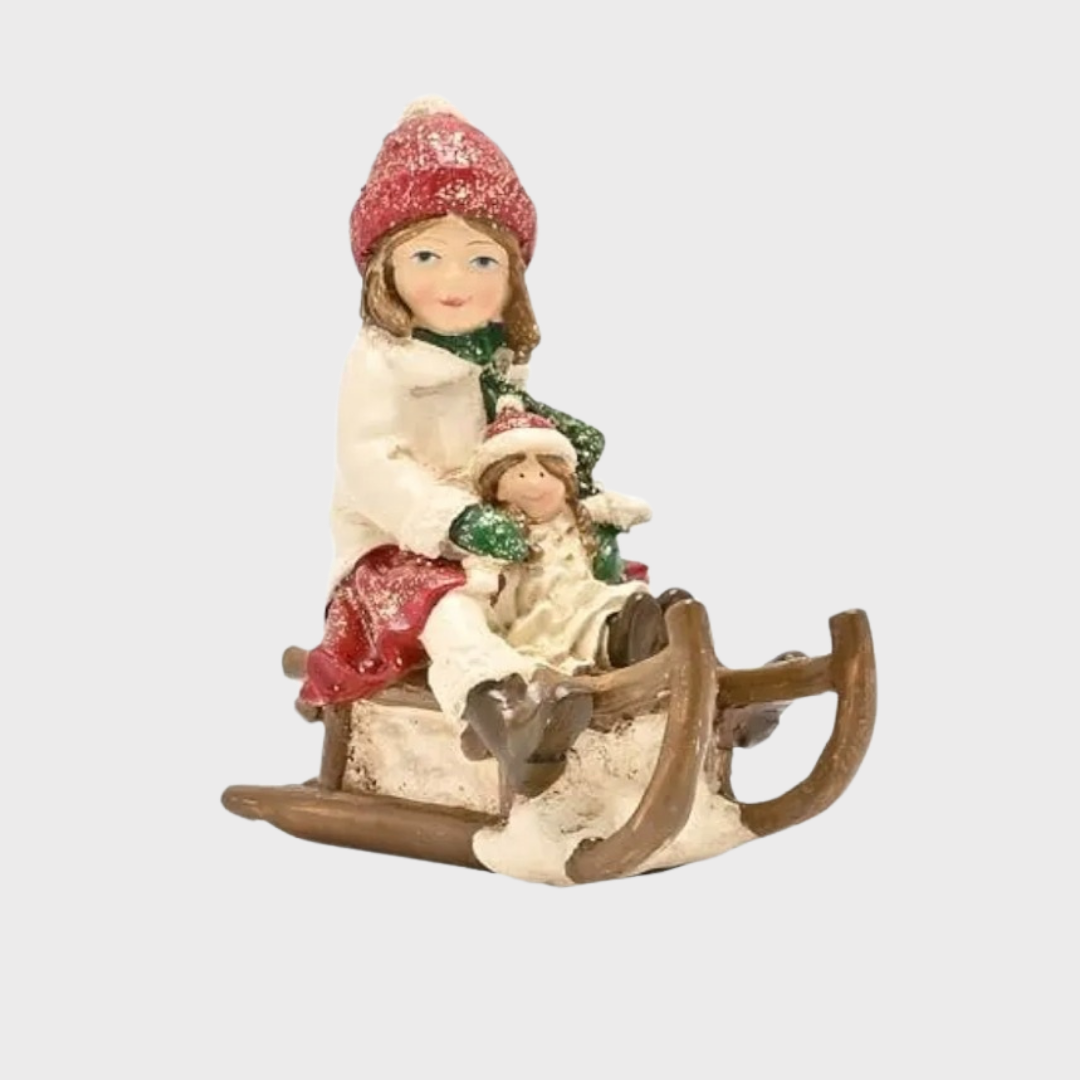 Victorian Girl on Sledge Figurine