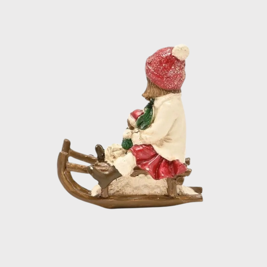 Victorian Girl on Sledge Figurine