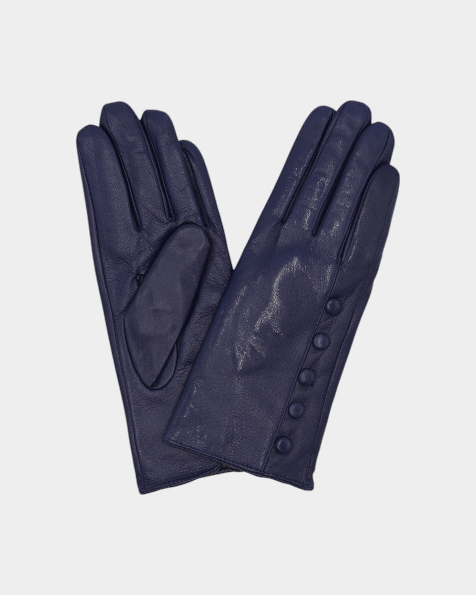 Ladies leather gloves on neutral background