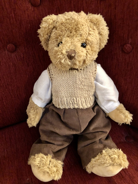 Sweet brown jointed teddy with cord trousers and knitted tank top. 40cm in height.

 

